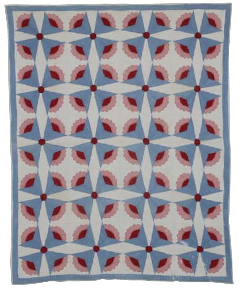 a quilt includes pink, red, and blue flower bouquets