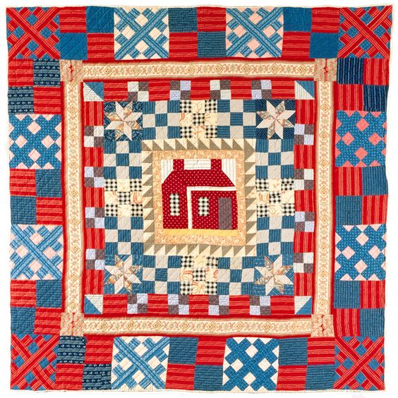 a quilt with house medallion with multiple borders patterns.