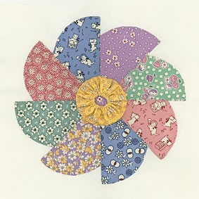 a quilt with a pattern of pinwheel