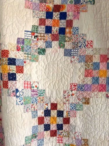 a quilt with a pattern of squares chain