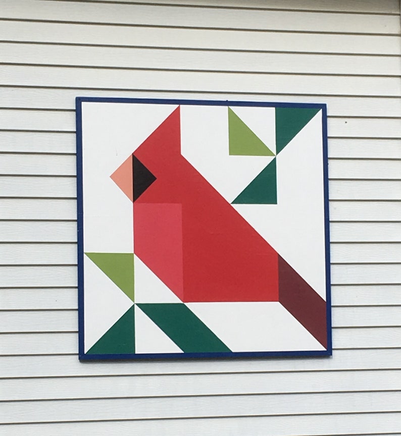 a barn quilt hanging on the wall