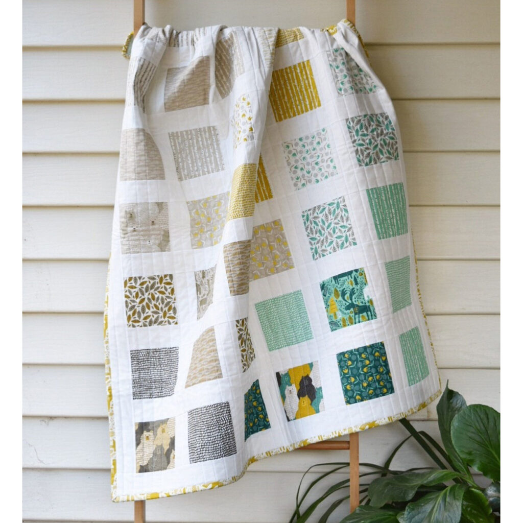 Frolic is a charming baby quilt pattern with a simple yet striking design