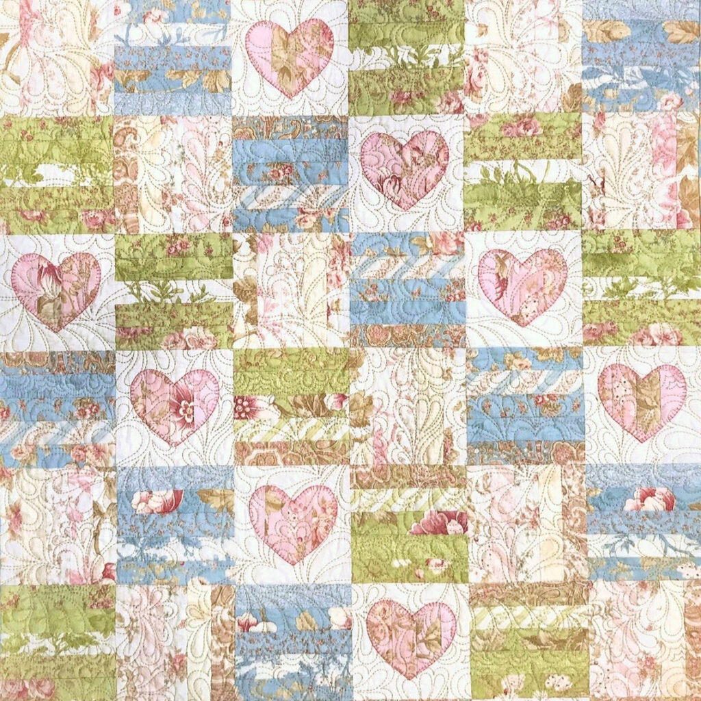 A sweet and simple baby quilt pattern in soft pastel tones