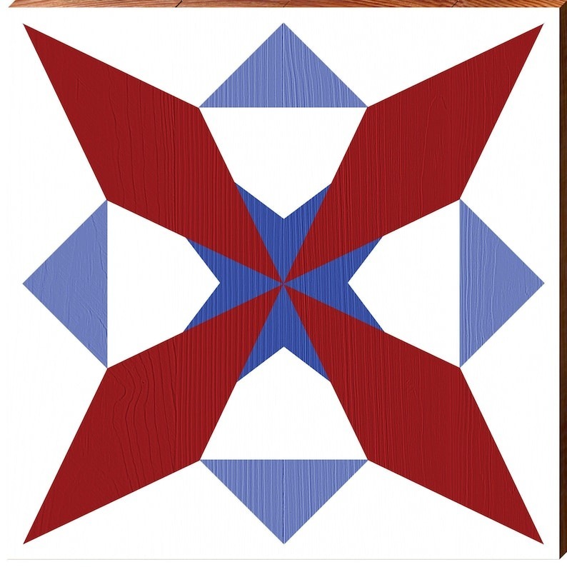 a barn quilt with the red windmill pattern.