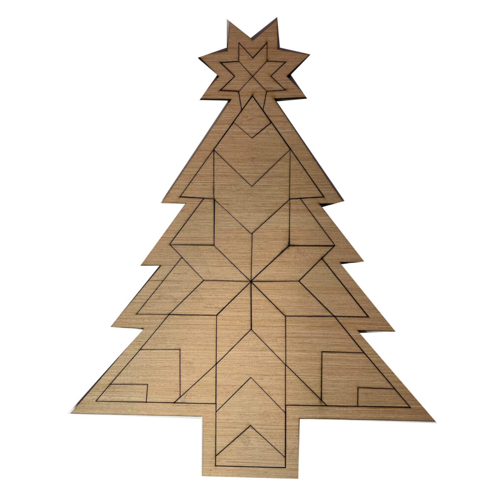 the barn quilt with a small star carved into the trunk of a pine tree.