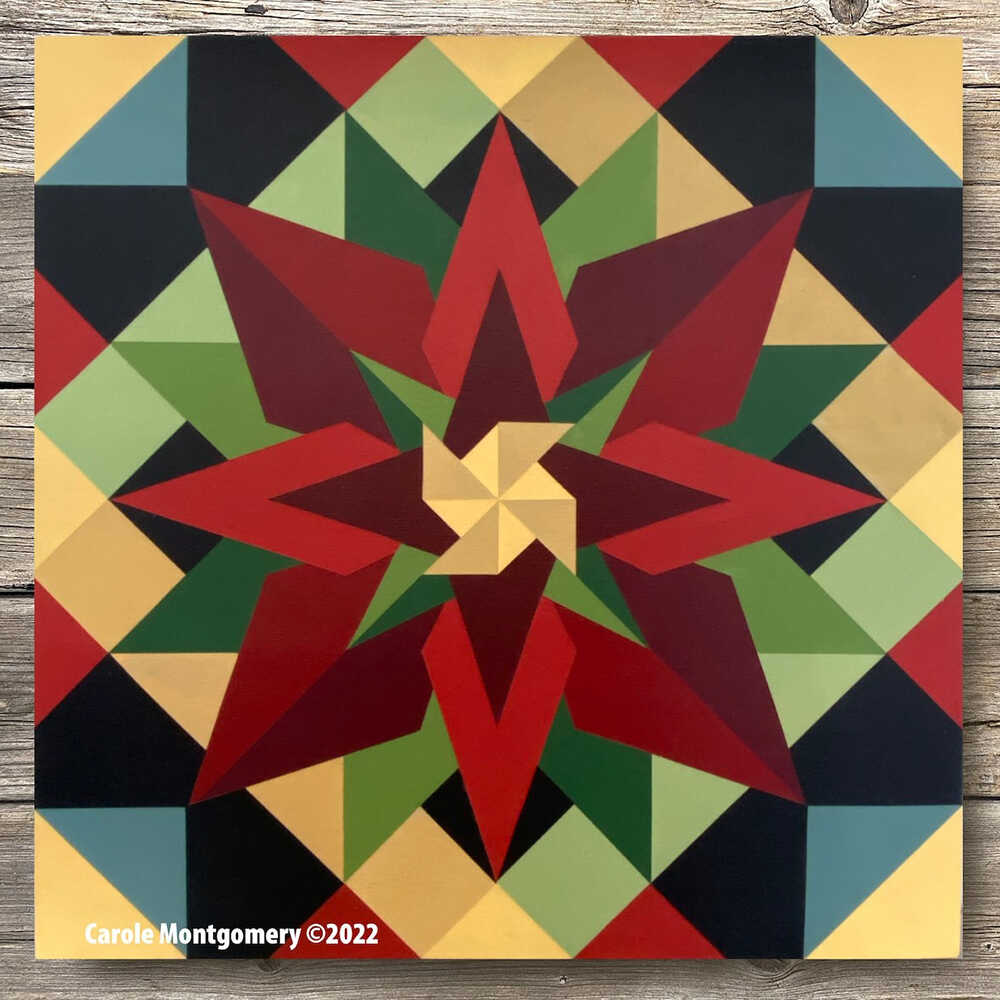 a barn quilt with green and red flower pattern