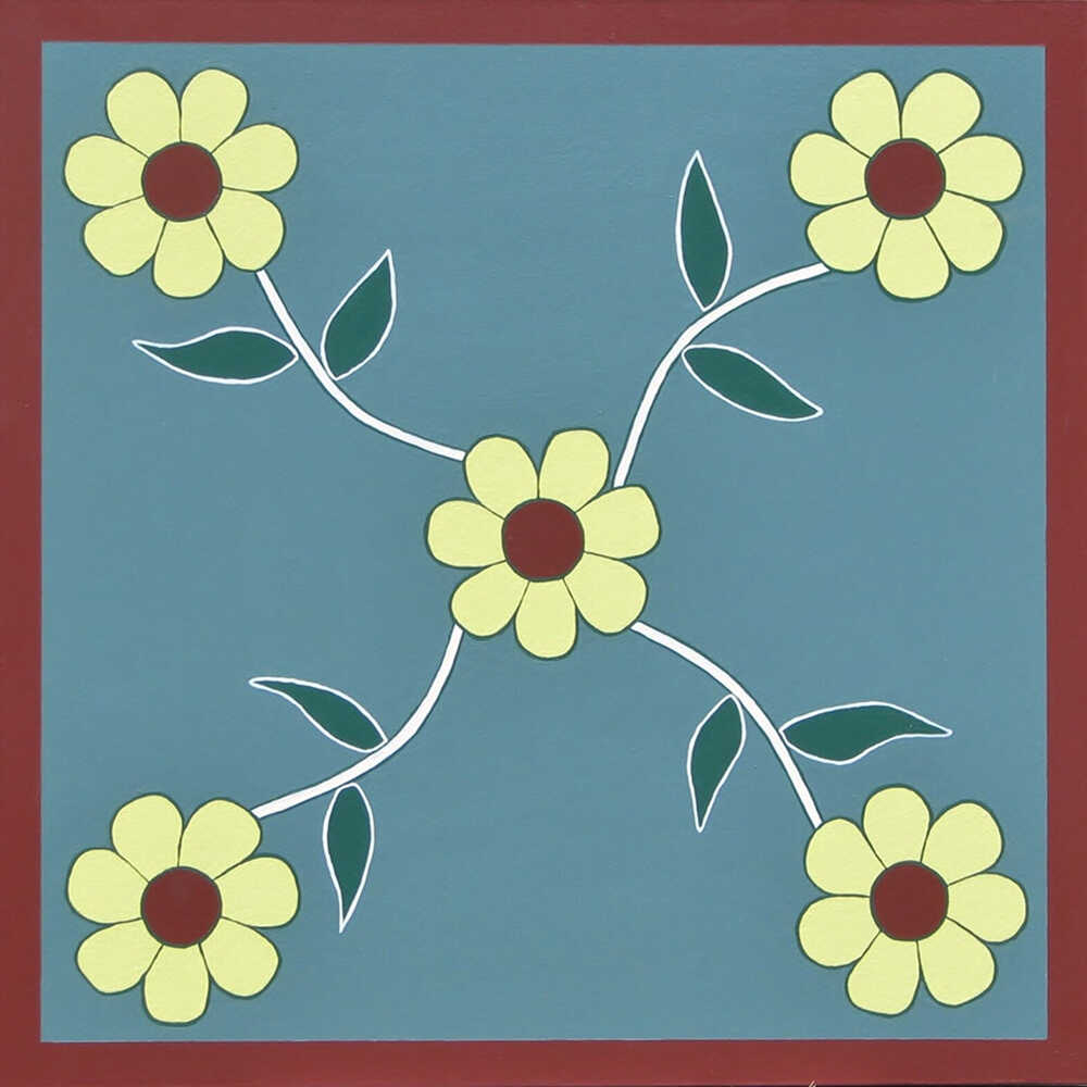 a barn quilt with small flowers pattern