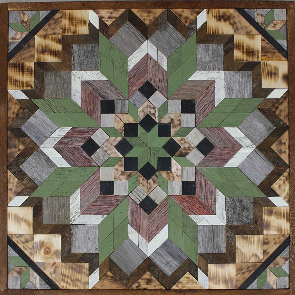 a barn quilt with colorful flower pattern