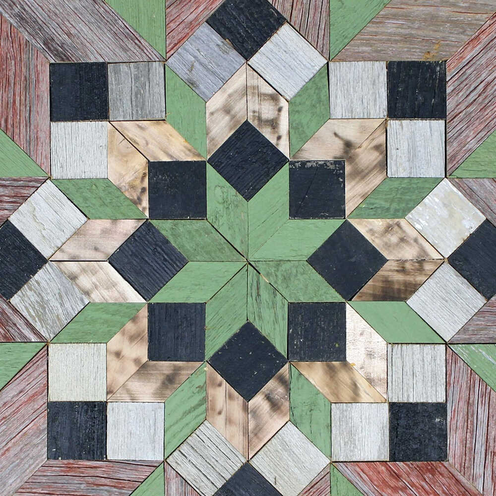 center of barn quilt with colorful flower pattern