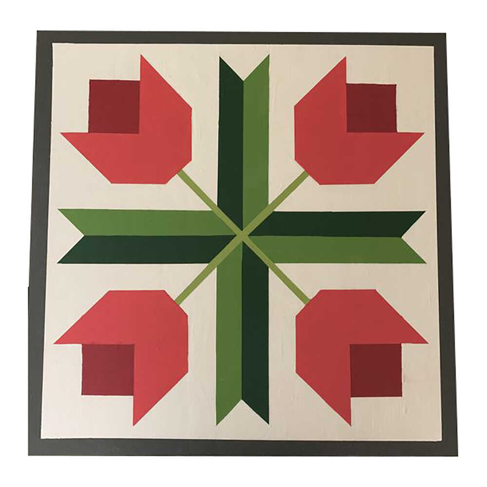 a barn quilt with four tulips pattern