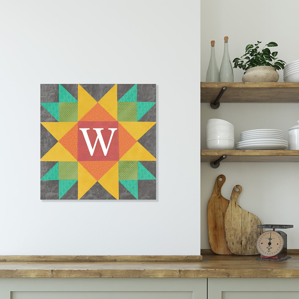 a barn quilt with yellow star hanging on the wall