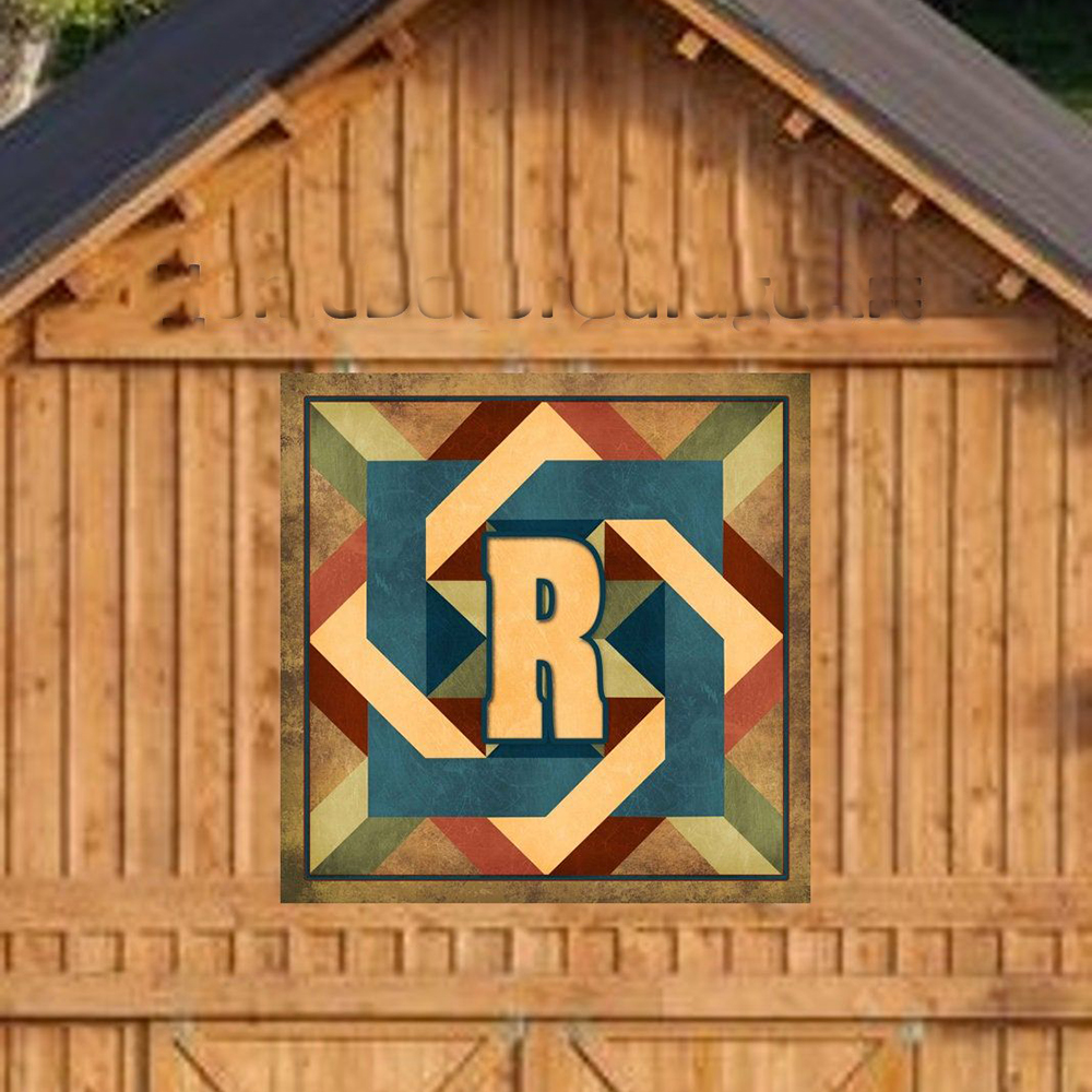 a rustic barn quilt hanging on the wooden barn