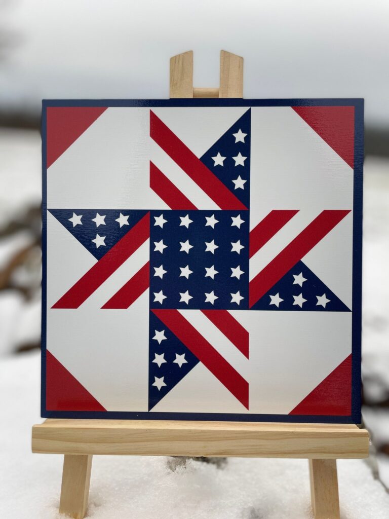 a barn quilt  American Flag pattern placed on the wooden rack