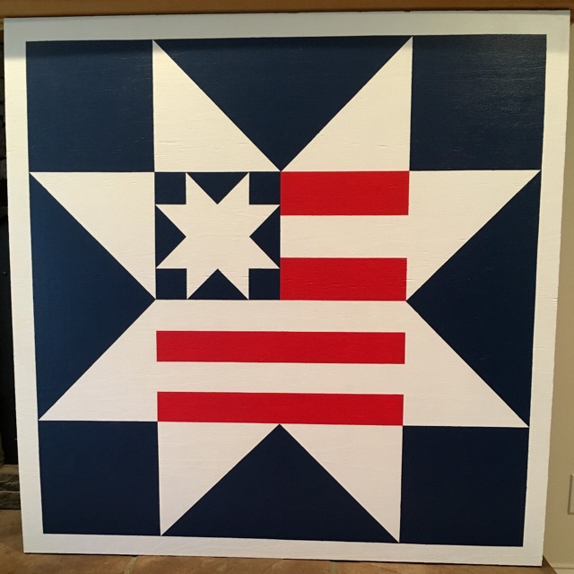 a barn quilt with an American Flag pattern