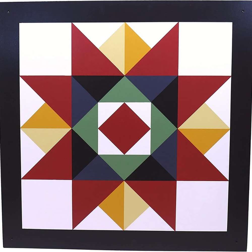 a barn quilt with the red star pattern