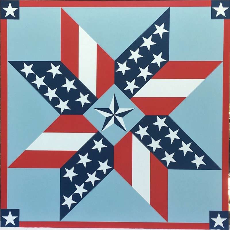 a barn quilt with the American flag star pattern
