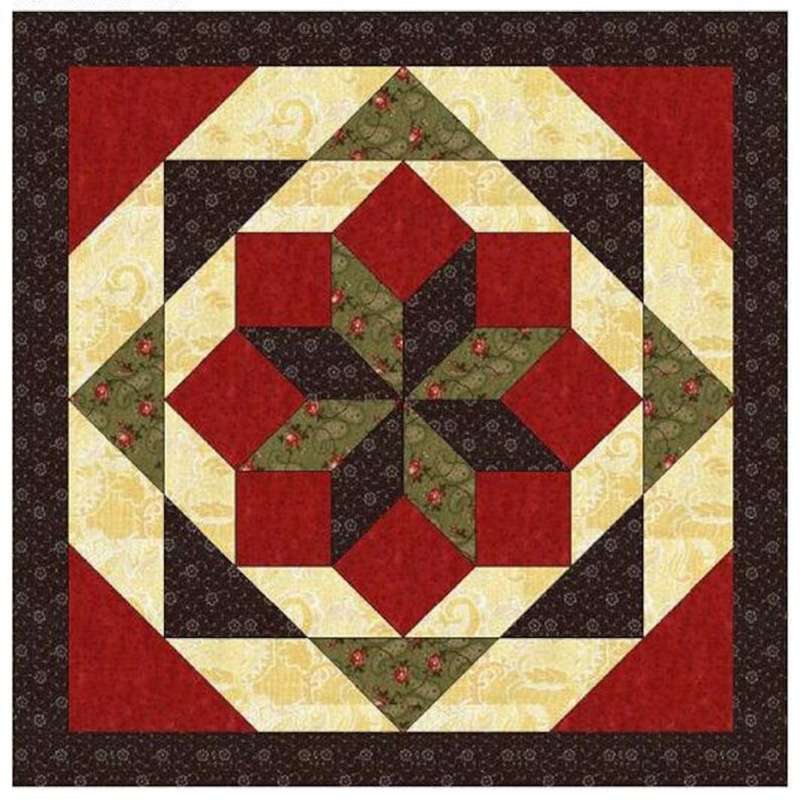 a barn quilt with moss green star pattern