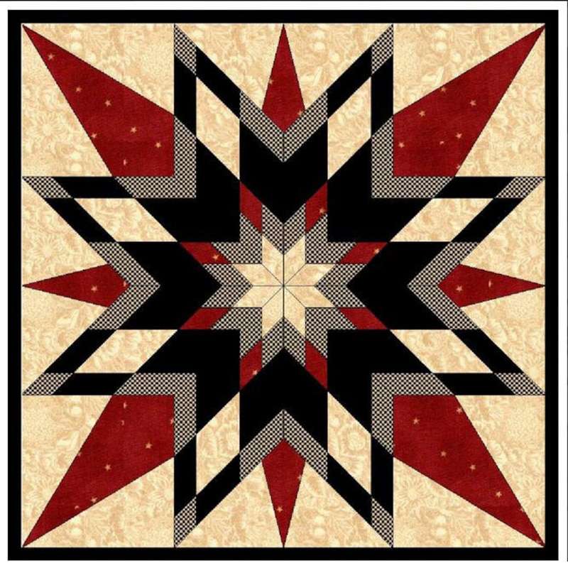a barn quilt with the red and black star pattern