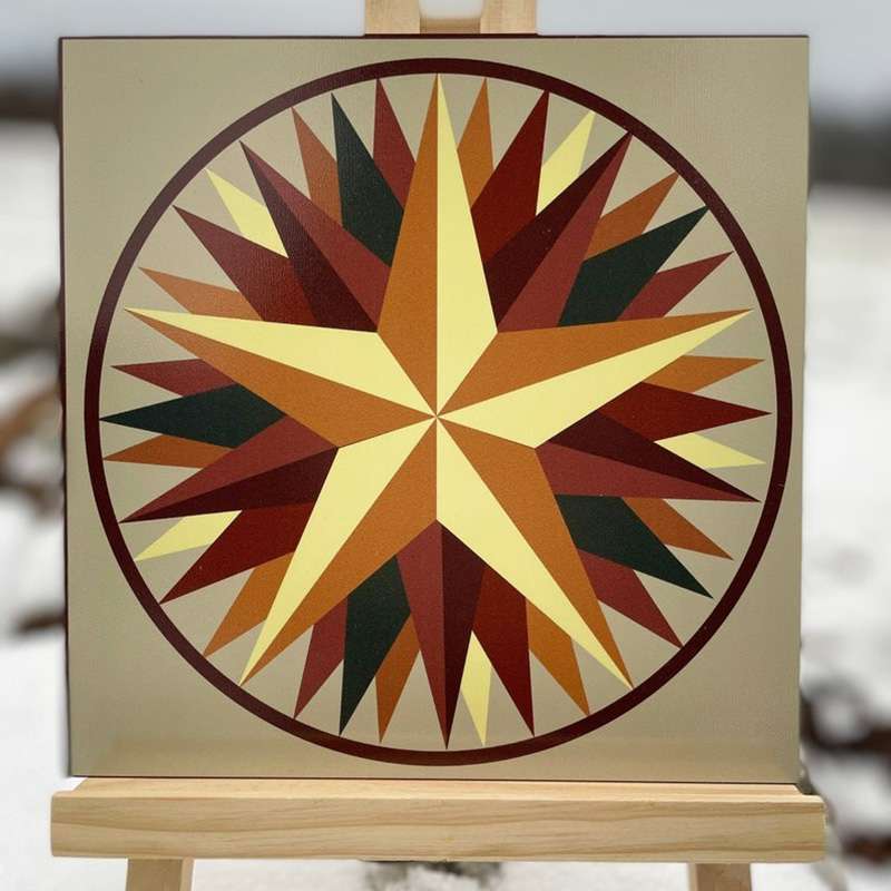 a barn quilt with the yellow star pattern placed on the wooden shelf in the outside