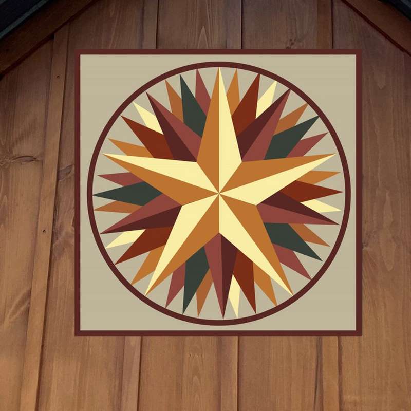 a barn quilt with the yellow star pattern hanging on the wooden barn
