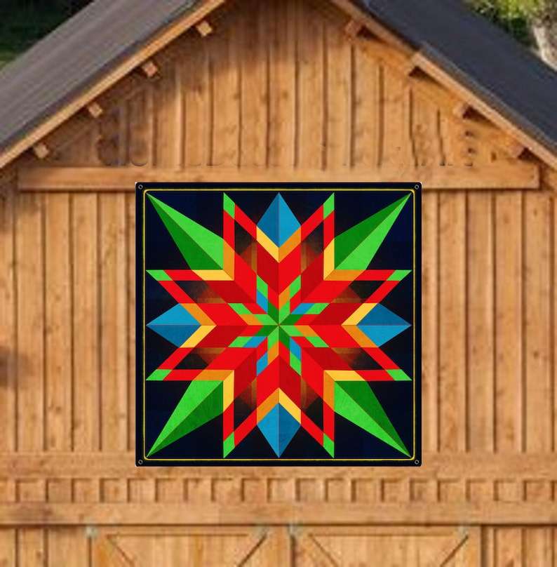 a barn quilt with colorful star pattern hanging on the wooden barn