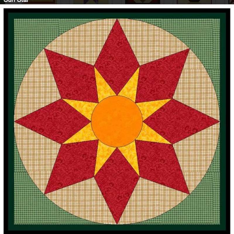 a barn quilt with sunshine star pattern