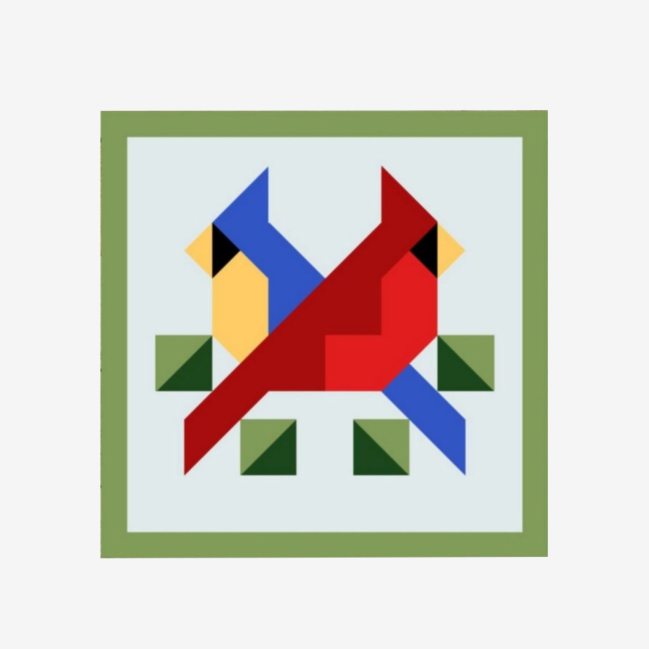 the barn quilt with a red bird and a blue bird pattern
