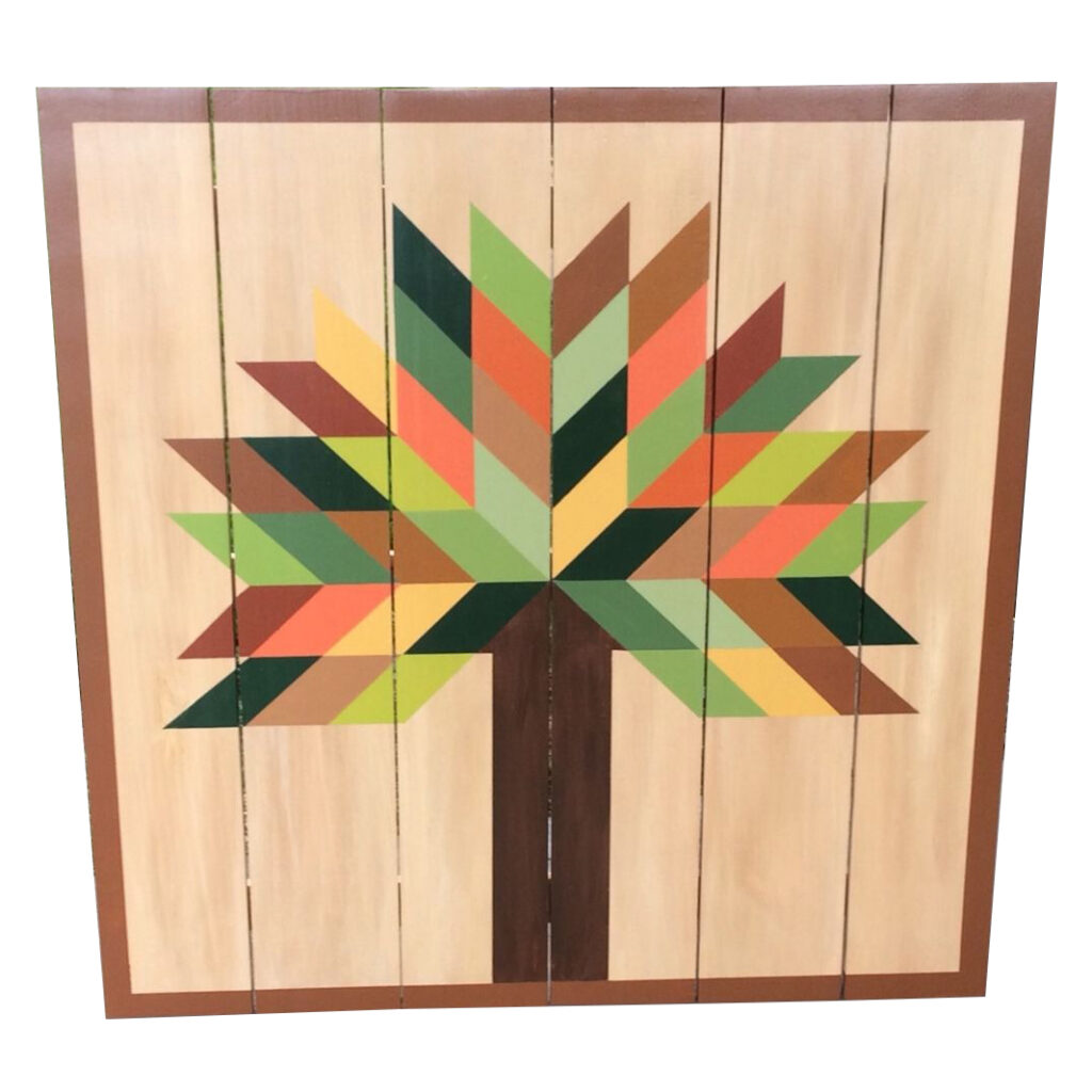 the square barn quilt with colorful tree pattern.