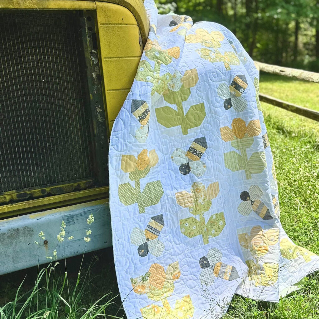 The Bumble Bees Yellow Flowers Quilt Pattern features charming designs