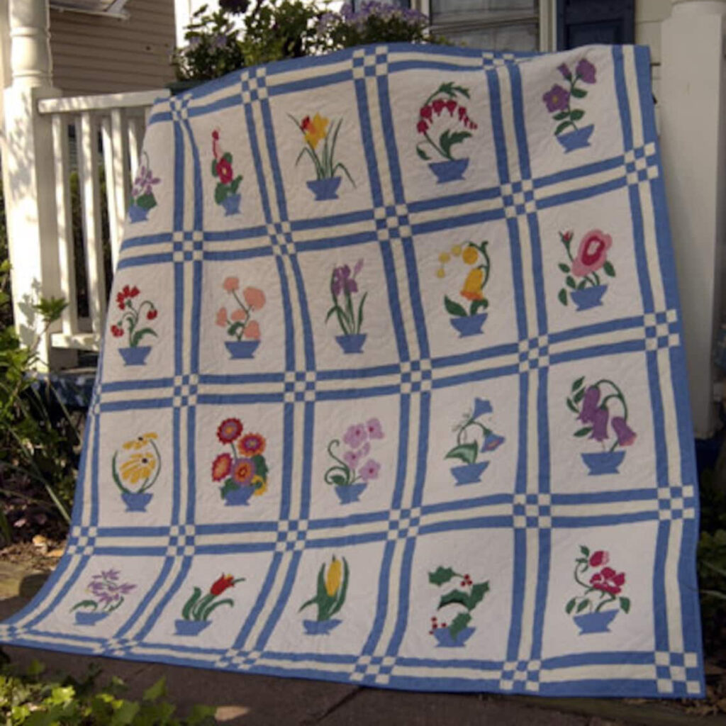 The Memory Bouquet Flower Quilt Pattern features a vibrant arrangement of floral blocks