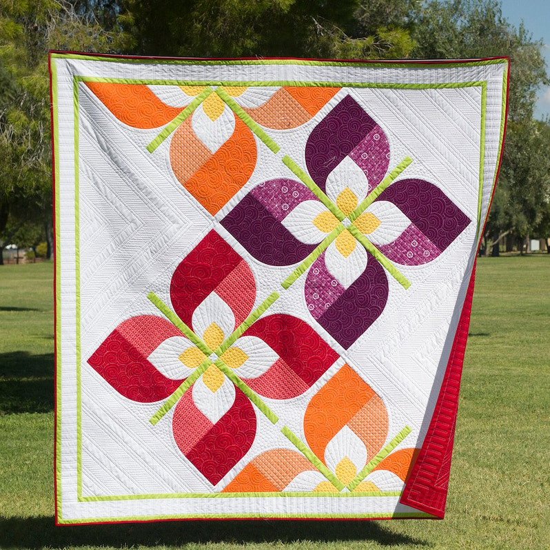 The windy flower quilt pattern captures the beauty of flowers dancing in the wind